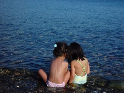 two-girls-river-lake-sea