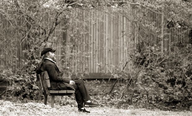 man-sitting-park-bench