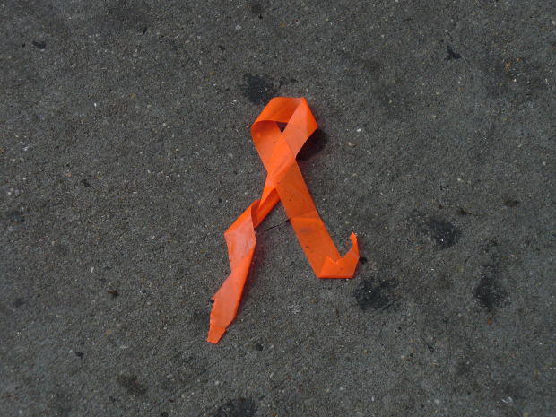 HIV AIDS symbol made by paper on road